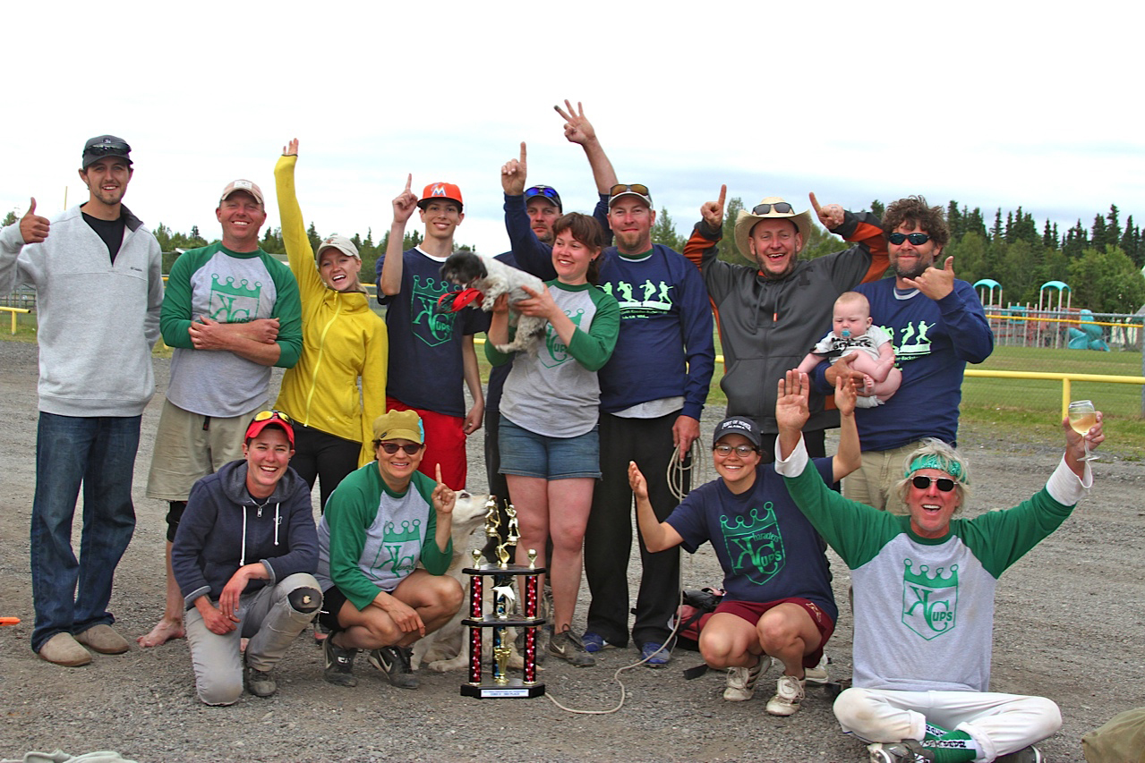 Kharacters/Cups co-ed softball team celebrates its third place D bracket trophy after the Kenai Firecracker Tournament last weekend. Homer's Spenard Builders Supply won first in the same league and Beluga Lake Lodge scored sixth place in the C bracket. Top row from left to right: Adam Treweiler, Jason Boyd, Britni Johnson, Patrick Cashman, Mike Zelinski, Theresa Tilter, Steve Rich, Hez Tilter, Mike Werts holding Brady Werts