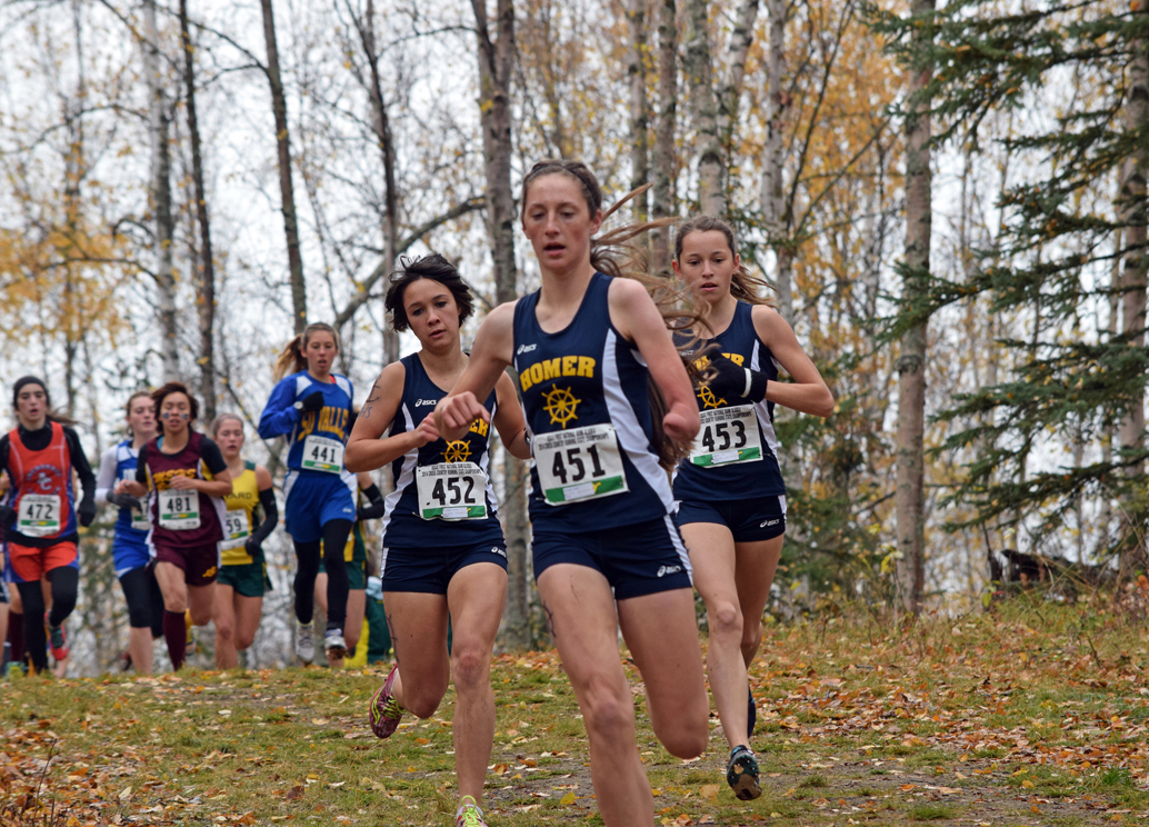 Mariners Molly Mitchell, 452, Megan Pitzman, 451, and Alex Mosley, 453, run in the girls varsity 123A state cross-country championship in Anchorage on Saturday. The Homer girls team earned a state championship title and the boys scored a third-place finish.-Photo by Jim Wolfe