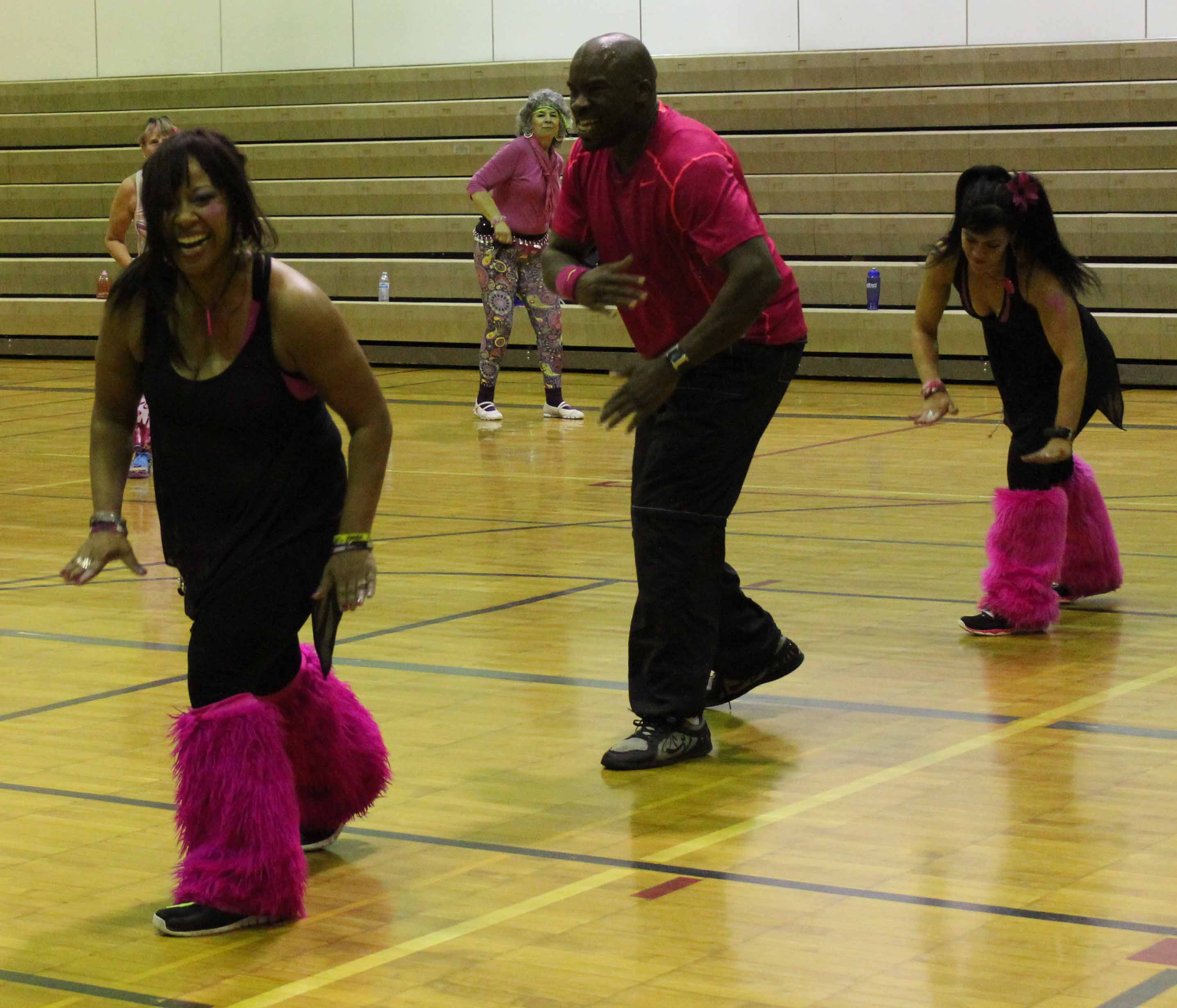 Visiting Zumba instructors Mary McKern, Tra Dinkins and Julie Slagle of Anchorage lead a routine during Saturday’s Zumbathon to raise breast cancer awareness.-Photo by McKibben Jackinsky, Homer News