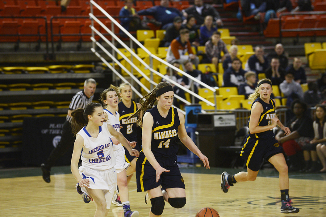 Homer junior Madison Akers grabs a steal and rushes down the court for a layup midway through the second half against Anchorage Christian Schools on Friday at the Sullivan Arena. The Mariners lost 34-23.-Photo by Joey Klecka, Morris News Service - Alaska