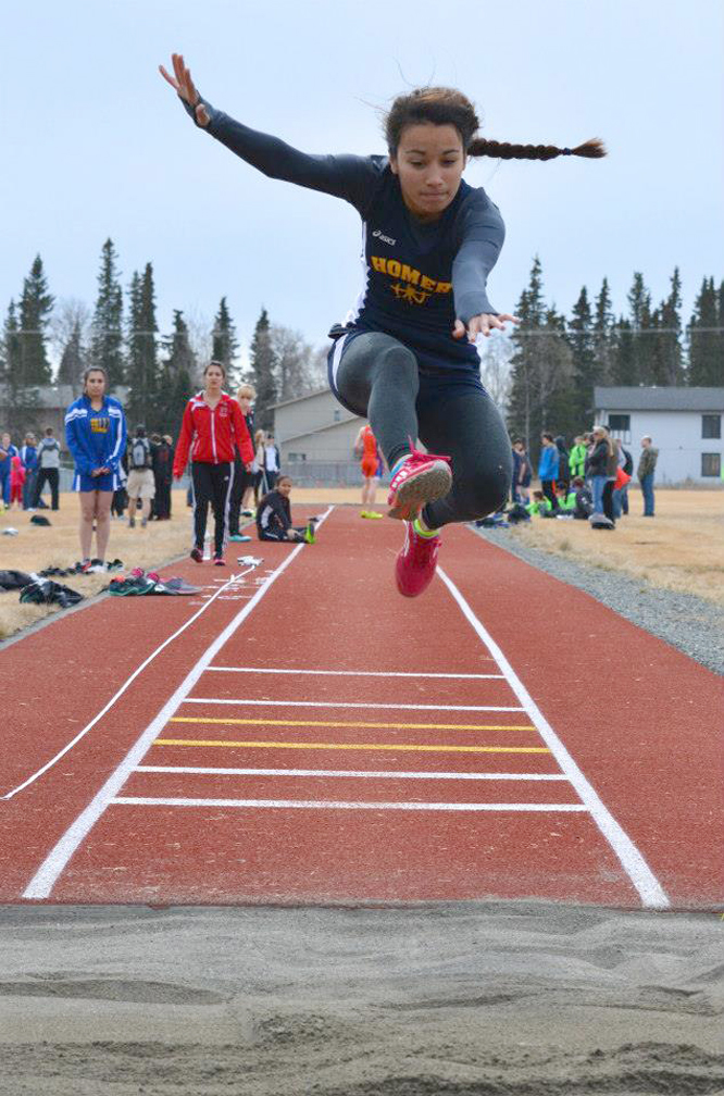 Mariner Crystal Crane takes a running leap during the Kenai Invitational last weekend.-Photo provided