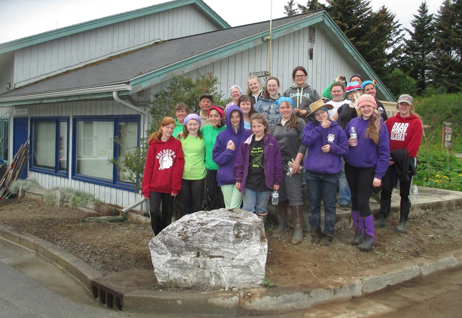 Participants in the Church of Jesus Christ of Latter-Day Saints’ Kalifornsky Beach Ward Young Women’s Camp pose in front of the Seldovia Police Department. Earlier this summer the girls  cleared the area around the building of weeds and rocks as part of the camp’s purpose “to serve others, to serve in their community and to do hard things.”