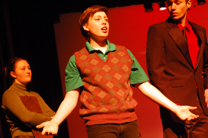 Zack Nelson sings in a scene from “The Sound of Plaid.”-Photo by Michael Armstrong, Homer News