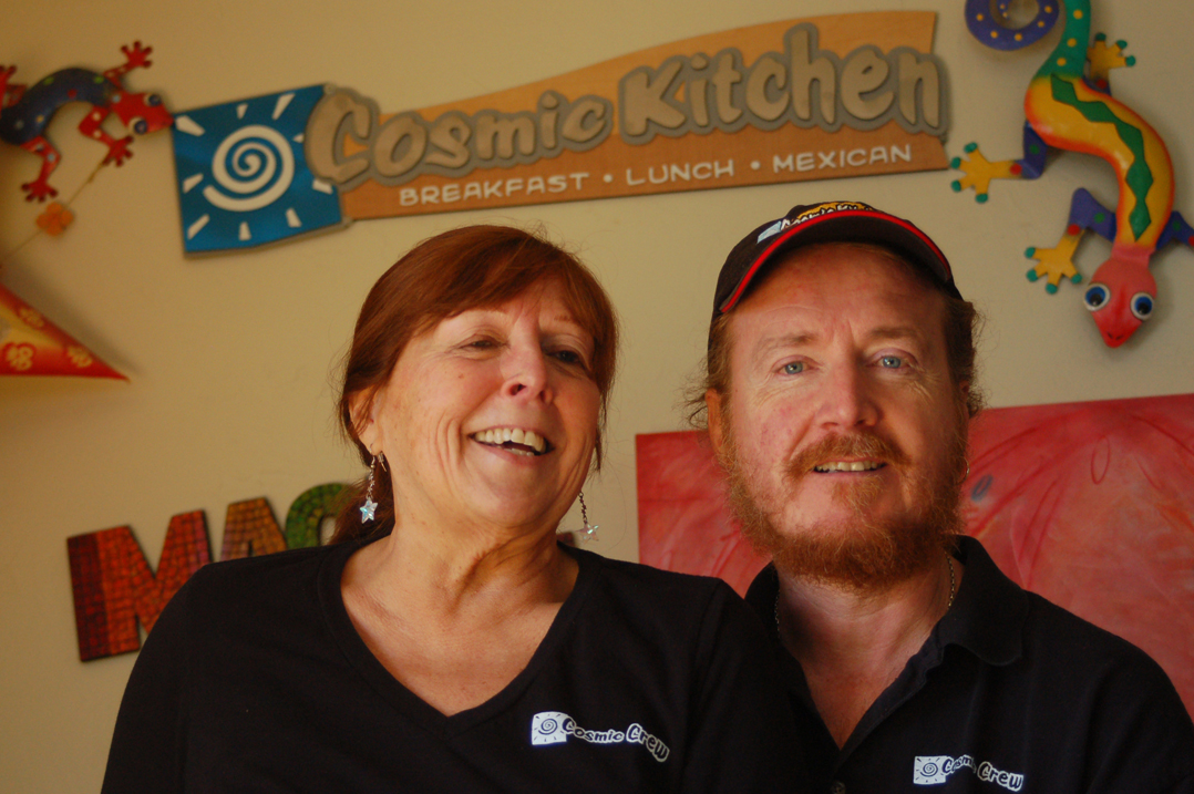 Michelle Wilson and Sean Hogan stand in a corner of their restaurant, Cosmic Kitchen, celebrating its 10th anniversary this month.-Photo by Michael Armstrong, Homer News