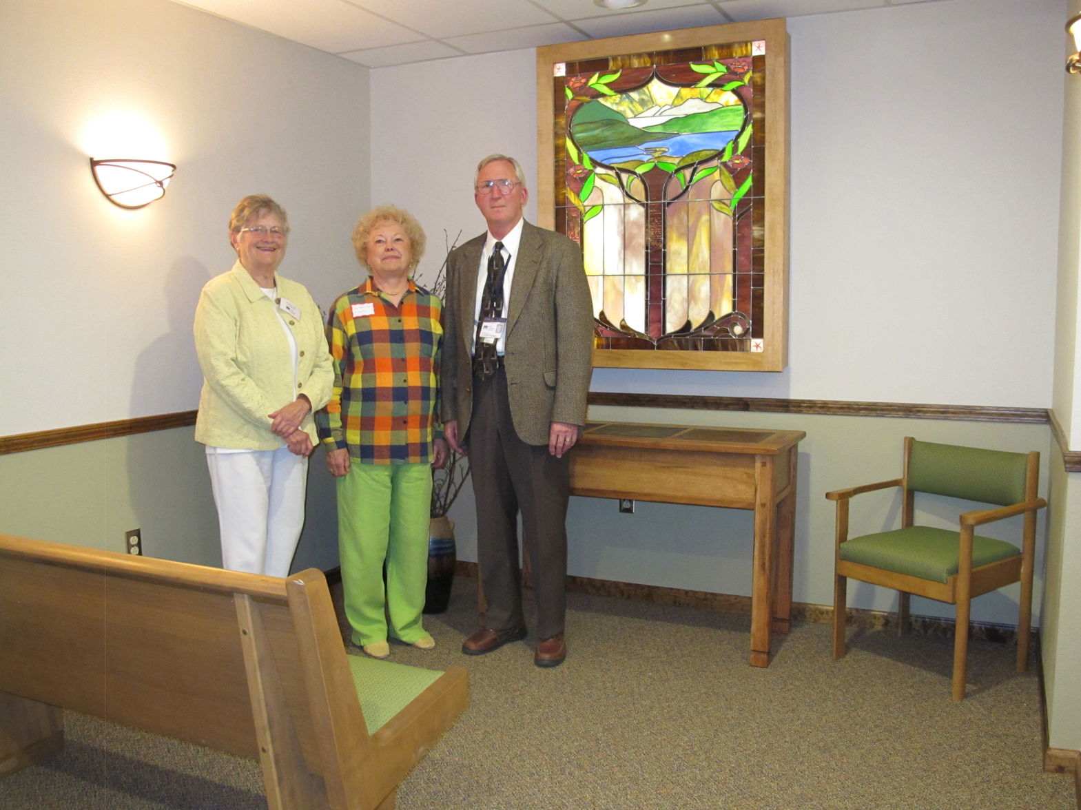 Phyllis Cooper, South Peninsula Hospital Foundation President; Jan Goehringer, SPH Auxiliary Secretary and room designer; and Bob Redmond, SPH chaplain, pose in the hospital’s new Reflection Room. There will be an open house for the public to view the Reflection Room from noon-2 p.m. Sept. 8.                       -Photo provided