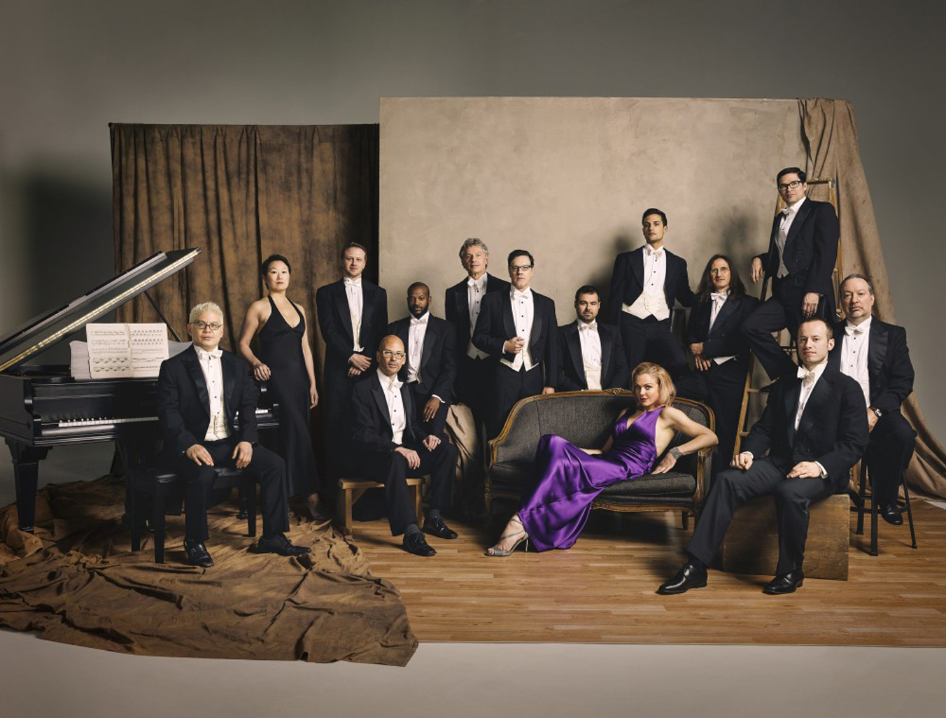Pink Martini features founder Thomas Lauderdale, left, at the piano, and singer Storm Large, center, on couch. The mini orchestra performs at 7:30 p.m. Monday, Sept. 14, at the Mariner Theatre.-Photo provided