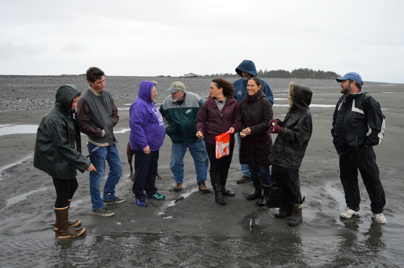 A group of Homer Jews gather on Bishops Beach to throw pieces of bread into the water on Sept. 13. The bread symbolizes sins, and the practice is part of the Jewish holiday of Tashlich, a day of repentance.-Photo by Annie Rosenthal