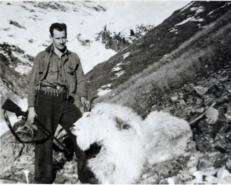 Wendell Stout stands next to a mountain goat he shot in Alaska on a visit in the early 1940s.-Photo provided