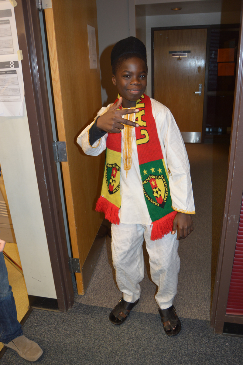 Cameroonian exchange student Nouredine Mama poses in traditional dress during a presentation about his country for students at Nikolaevsk School on Nov. 25.-photo by Annie Rosenthal