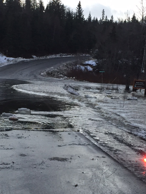 Water floods the Old Sterling Highway near the Anchor Point Road on Wednesday morning. An ice jam caused water to back up near the bridge.-Photo by Trooper John Probst, Alaska State Troopers