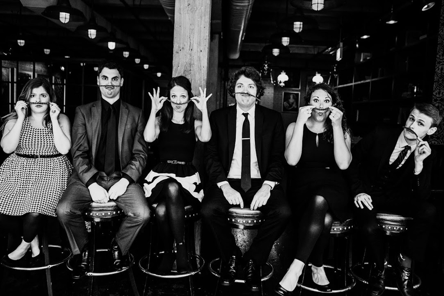 Members of The Second City touring group ham it up in a publicity photo. From left to right are Jo Feldman, Chucho Pérez, Lisa Barber, Nick Rees, Rachel LaForce and Adam Schreck.