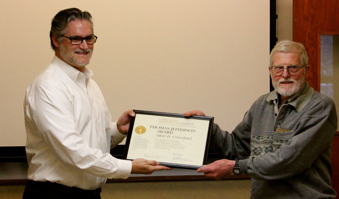 James Nelson, left, Science and Operations Officer, National Weather Service, Anchorage, presents the Thomas Jefferson Award to Allan Crawford, right, at a ceremony on Oct. 20 at the National Weather Service Anchorage forecast office. 