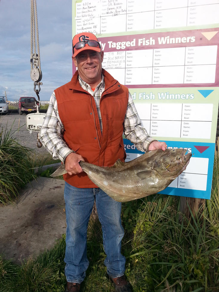 Andrew VanderPlaat of Pendleton, Ore., shows off his tagged halibut worth $500.-Photo provided