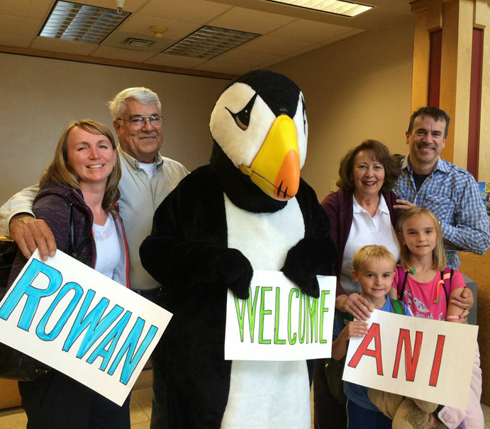 The LeFevre family pose with the Homer Senior Citizens puffin at the Homer airport in July. From left are Karyn, Russ, the puffin (Kyle Edens), Jane, Rowan, Ani and Russell LeFevre.-Photo provided
