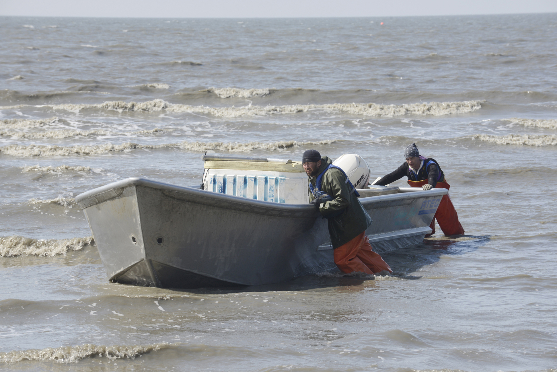 Setnetters in the Kasilof Section of the East Side Setnet Fishery push a boat into shore June 27, 2013. On Monday, Lt. Gov. Mead Treadwell rejected a proposed initiative that would have banned the use of setnets in Cook Inlet.