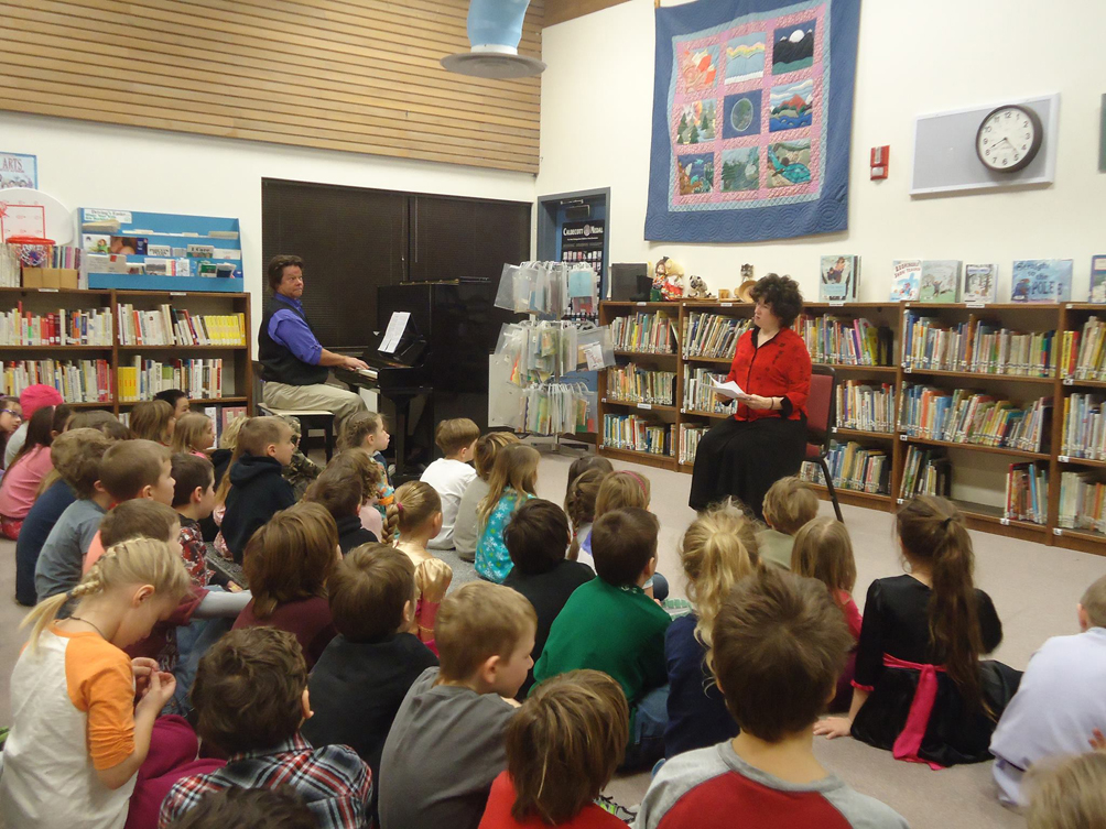 Musician Johnny “Johnny B” Bushell and author Sharon Bushell demonsterate the similarities between music and writing during a residency at McNeil Canyon Elementary School.-Photo provided