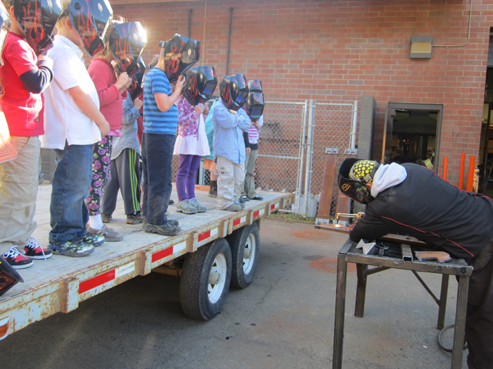 At Homer High School, Mickey Todd shows first-graders how a torch works.  -Photo provided