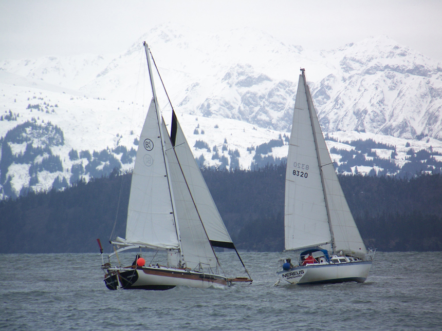 At the start of Saturday’s race, Morning Star, left, sails behind Nereus before taking the lead.-Photo by McKibben Jackinsky, Homer News