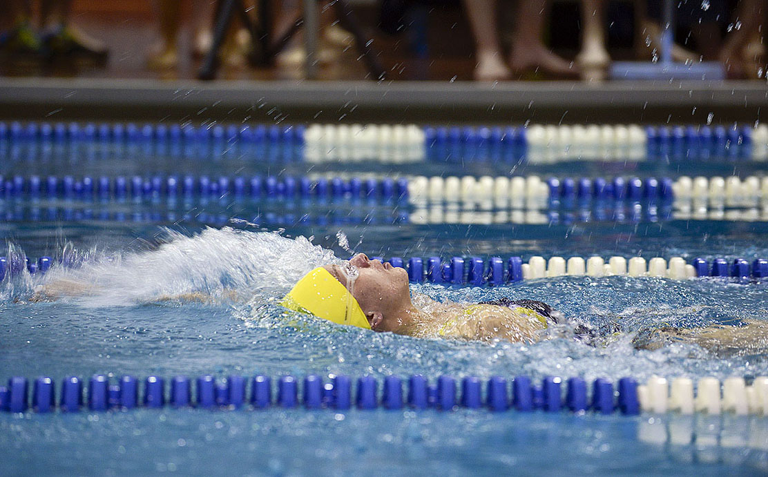 Homer’s Jenna Fabich swims during the 50-yard backstroke competition during SoHi’s Pentathalon in Soldotna on Friday.-Photo by Rashah McChesney, Peninsula Clarion