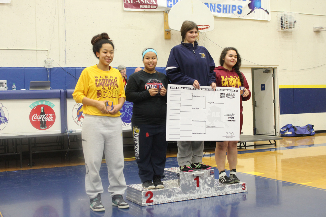 Homer Mariner’s Heather Harrington stands at the top of the podium a first-place champion at the first all-girls state wrestling tournament. Also pictured are Gillian Foxglove of Buckland, Ariel Akerlund of Mount Edgecumbe and Evelyn Evans of Mount Edgecumbe.