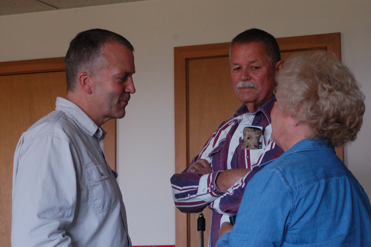 Dan Sullivan, left, speaks with Bob and Jan Goehringer at a campaign appearance by Sullivan last Thursday at the Kachemak Community Center. Sullivan is running for the Republican Party nomination for U.S. senator.-Photo by Michael Armstrong, Homer News