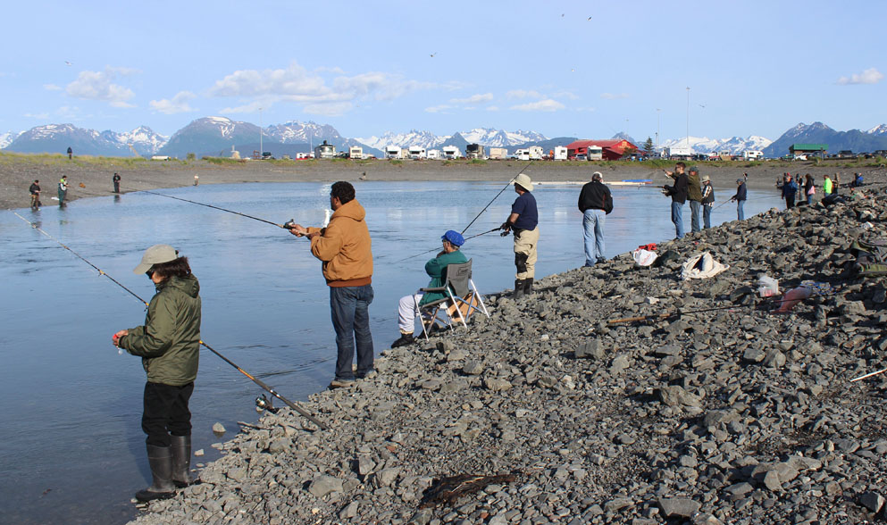 Anglers line up around the Nick Dudiak Fishing Hole on the Homer Spit on Friday, just in timeto welcome king salmon arriving on the evening’s incoming tide.-Photo by McKibben Jackinsky, Homer News