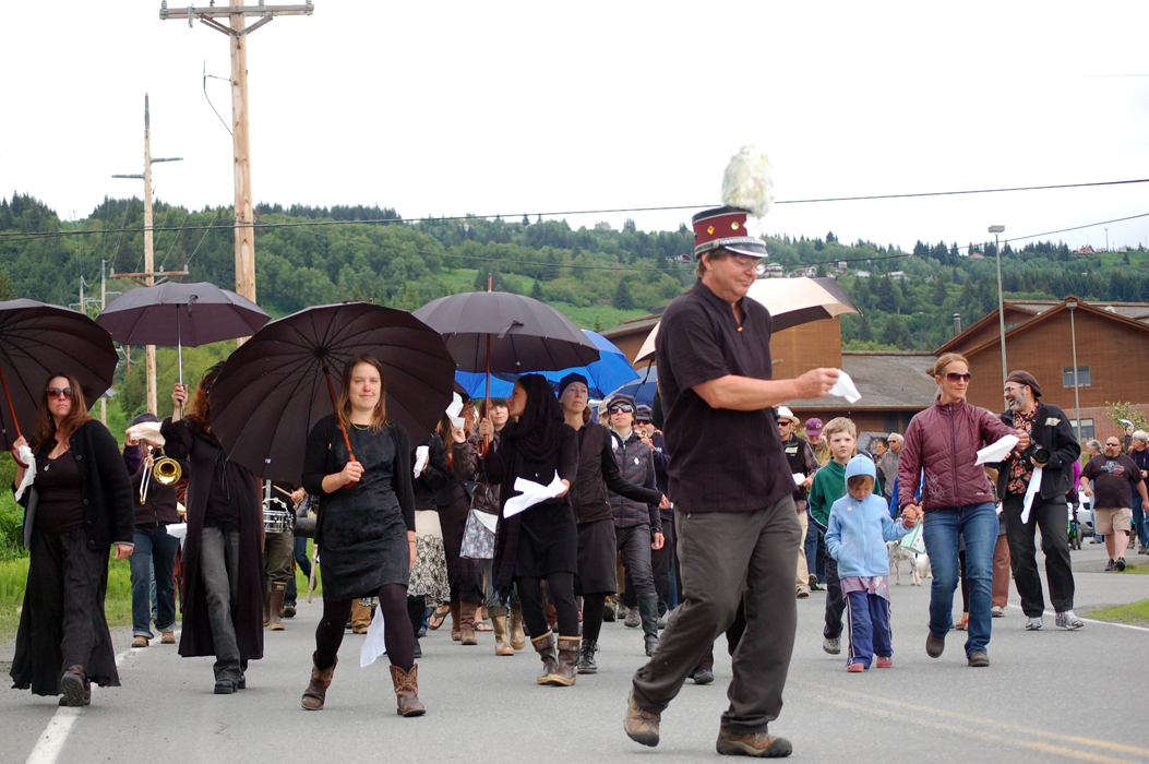 The Bossy Panties dancers and the Bossy Pants band and friends and family of Ray Garrity hold a second-line procession for him from Homer High School to Pioneer Avenue on Monday afternoon.-Photo by Michael Armstrong, Homer News