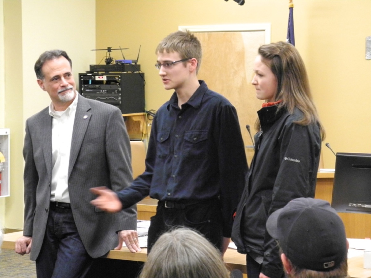 Kody Knox, center, speaks about a recent trip to the Alaska Legislature and Juneau as District O Sen. Peter Micciche, R-Soldotna, listens at a town hall meeting last Friday at the Cowles Council Chambers, Homer City Hall. Knox and his sister, Esther, right, are homeschool students from Ninilchik who recently studied the issue of methamphetamine and drug abuse. As a project, they went to Juneau to lobby for more funding for behavioral health services, specifically Serenity House, a substance abuse center in Soldotna.