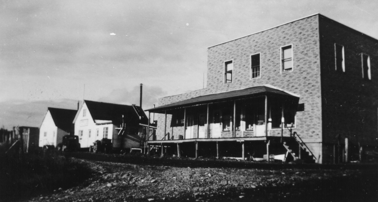An undated photo of Bunnell Avenue shows, from left to right, the Homer Women’s Club, the Homer Cafe and Club, and Berry’s Store, now the Old Inlet Trading Post that includes Bunnell Street Art Gallery and Maura’s Cafe. The Women’s Club was moved to Pioneer Avenue and is now Cafe Cups. -Photo provided, Pratt Museum