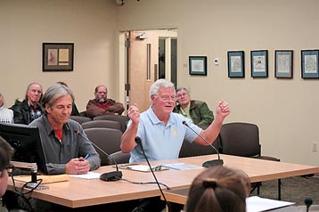 Developer Tony Neal, right, speaks on the Quiet Creek Subdivision replat on Dec. 4 before the Homer Advisory Planning Commission as surveyor Kenton Bloom, left, listens.-Photo by Michael Armstrong, Homer News