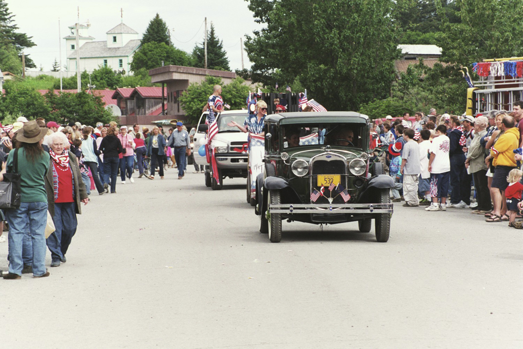 A Fourth of July parade in 2004 led by antique cars shows Seldovia’s timelessness.-Photo by Michael Armstrong, Homer News