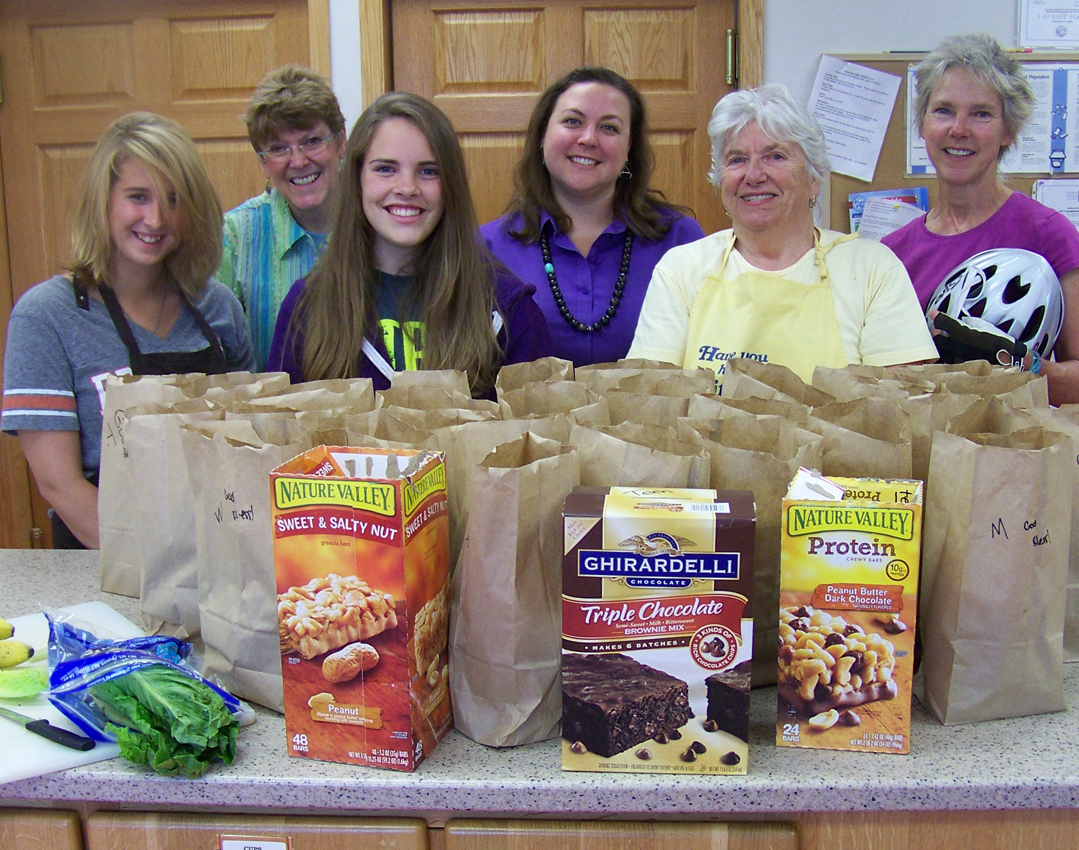 Reverend Lisa Talbott, center, the newly assigned pastor of Homer United Methodist Church, helps prepare lunches for Homer area teens. Pictured are, from left, Tirzah Hardy, Caroline Venuti, Claire Swanson, Talbott, Roberta Harris and Sherry Stead.-Photo by McKibben Jackinsky, Homer News