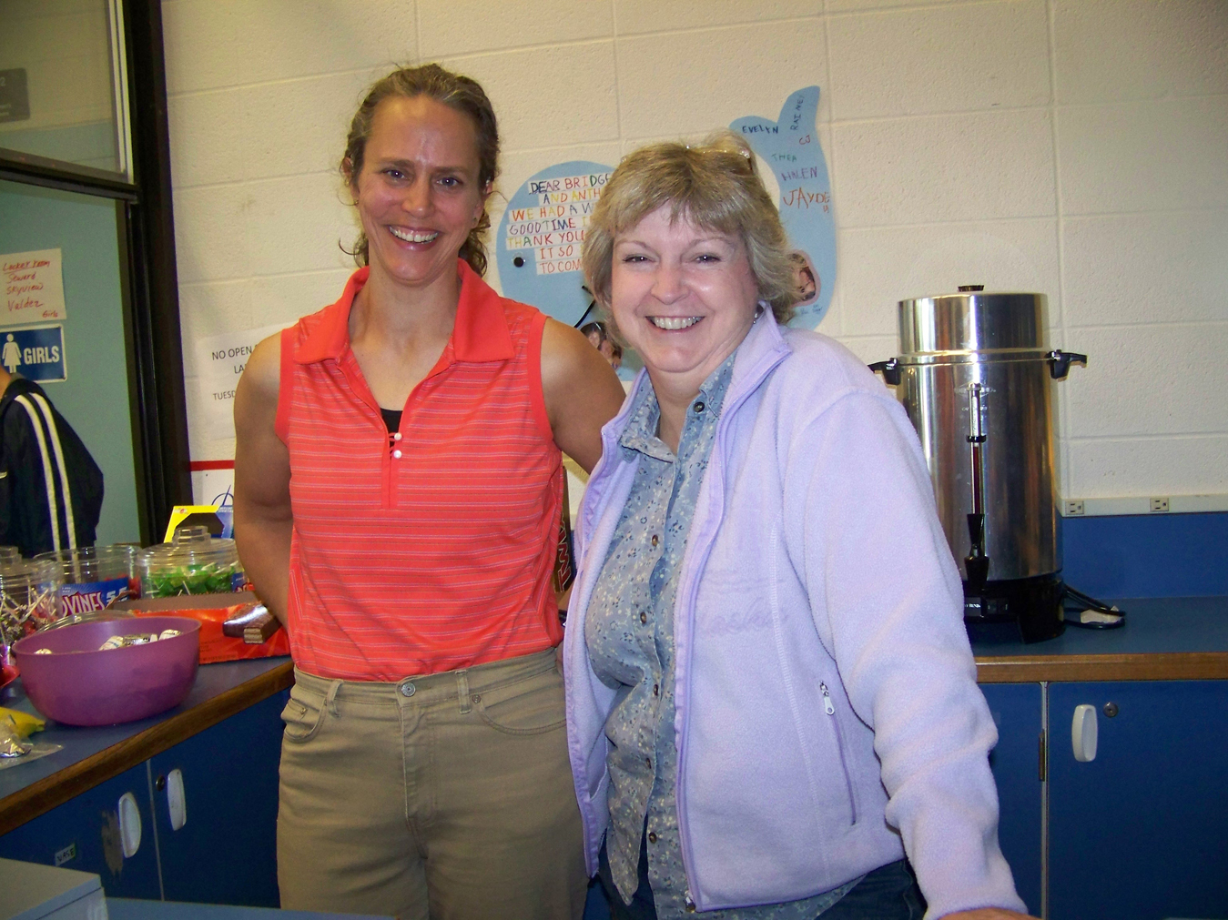Want to watch swimmers and divers at the Homer Invite? Want a cup of coffee or a snack? Homer High School parents Michelle Waclawski, left, and Vicky Peters, are there to help. Parents of cross country runners, they keep concessions open so parents of athletes on the dive and swim teams can cheer.-Photo by McKibben Jackinsky, Homer News