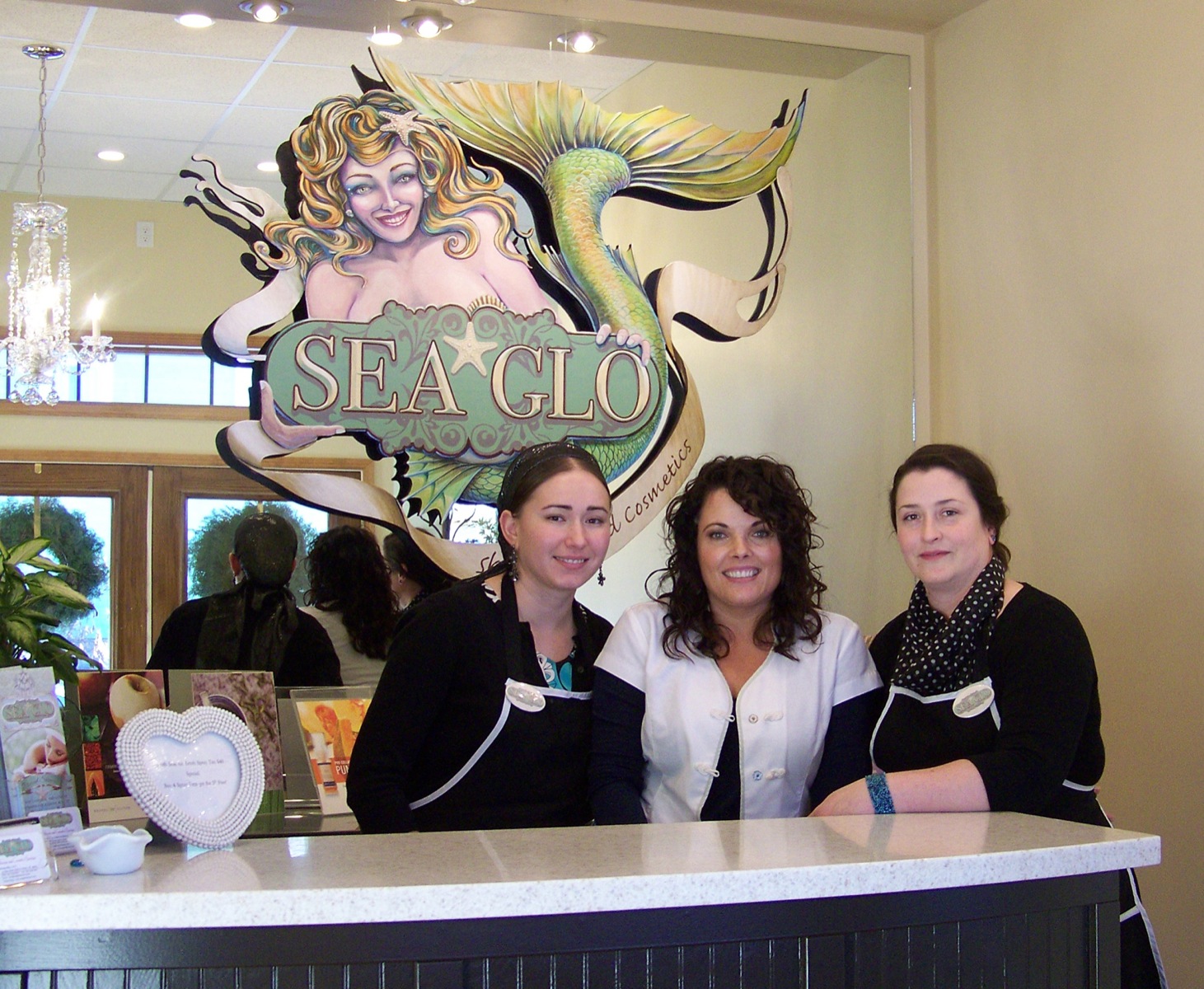 Karen Shealy, center, owner and operator of Sea Glo Skin Care and Cosmetic Boutique, poses with receptionist Antonina Martushev, left, and masseuse Melissa Mika. The boutique recently moved to a new location in Old Town.-Photo by McKibben Jackinsky, Homer News