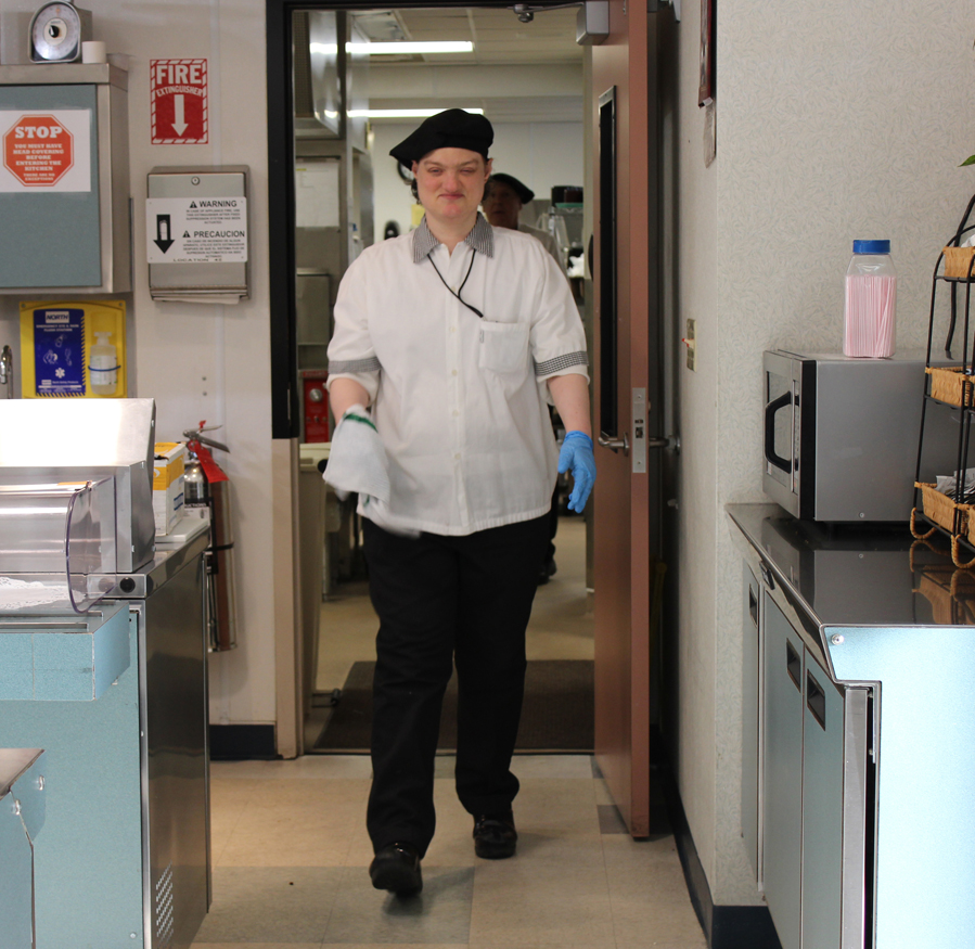 Stephanie Harry ensures the cleanliness of tables in South Peninsula Hospital’s cafeteria.-Photo by McKibben Jackinsky, Homer News