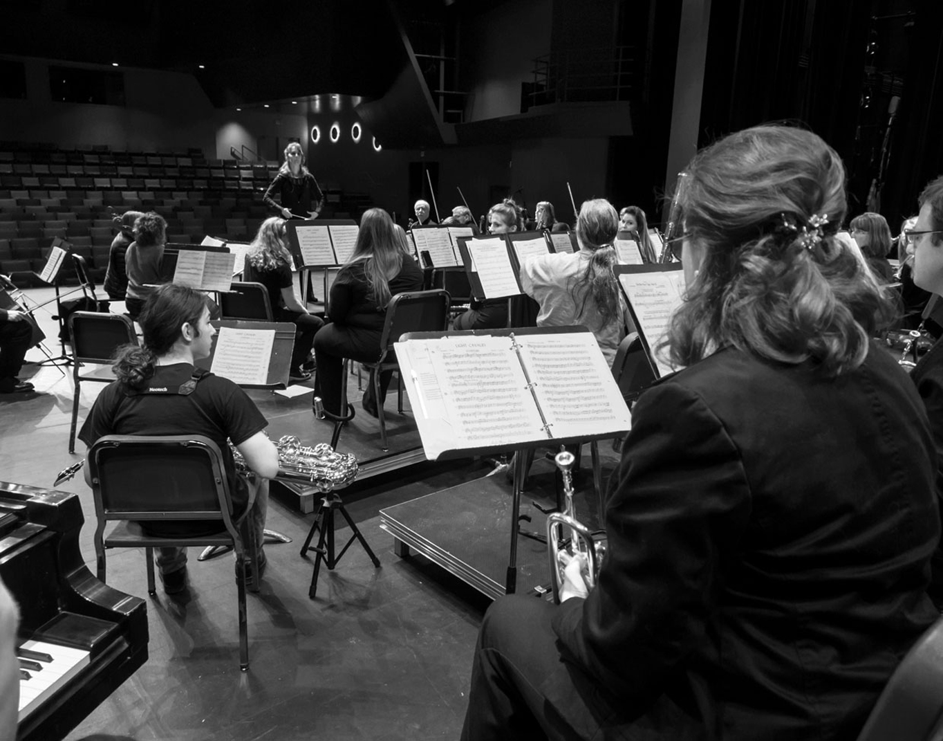 Artistic director Tammy Vollum-Matturro offers insight to musicians during a rehearsal for last Saturday’s Pops concert.-Photo by Sue Biggs