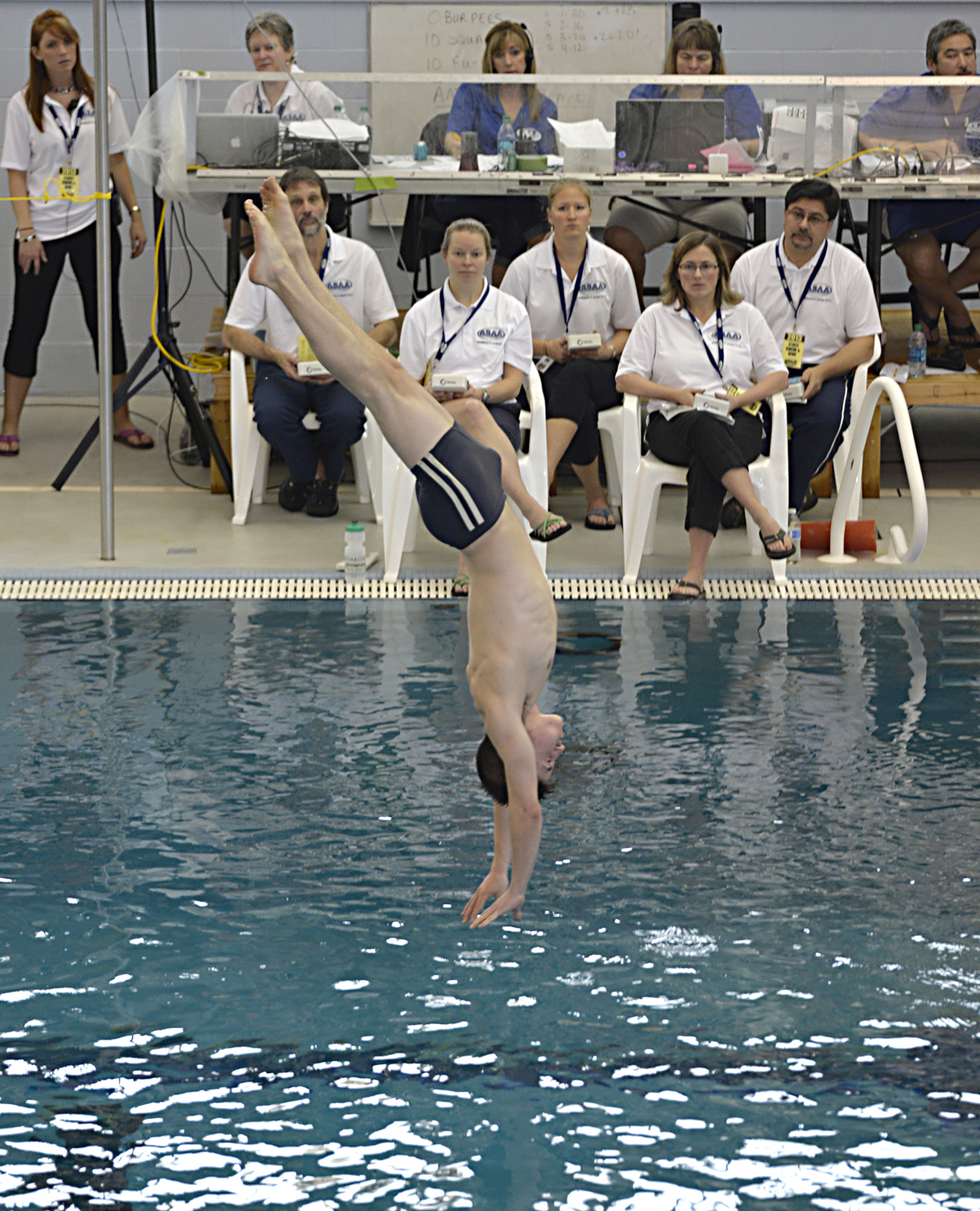 Homer’s Kaec Brinster dives during the finals of the ASAA/First National Bank Alaska Swimming & Diving State Championships on Saturday at Juneau’s Dimond Park Aquatic Center.-Klas Stolpe, Morris News Service-Alaska