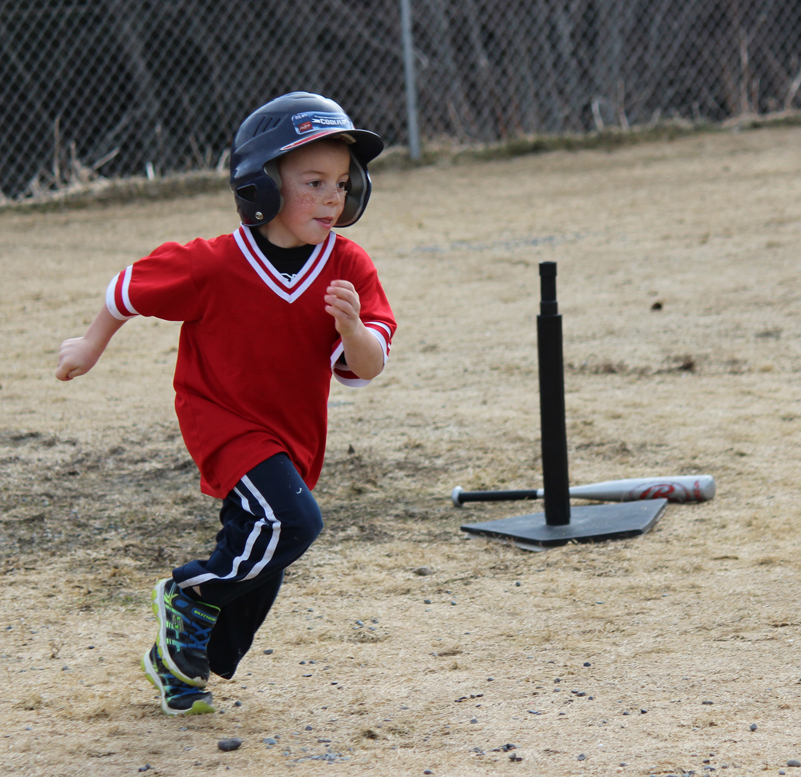 Josh Rudolph makes a dash for first base.-Photo by McKibben Jackinsky, Homer News