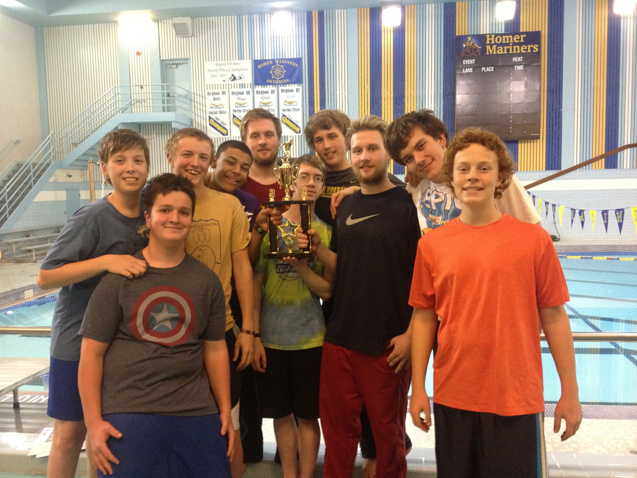 Showing off their hard-earned first-place trophy are Mariner swimmers (from left) Zachary Nelson, Hyram Dory, Greg Smith, Charlie Sadler, Mark Nagle, Cyrus Cowan, Remi Nagle, James Nagle, Thomas Vanek and Leo Castellani.-Photo by Shannon Reid