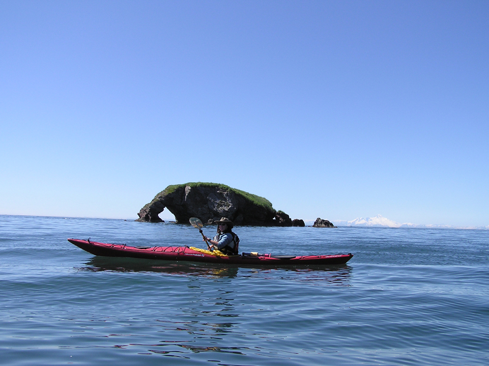 A kayaker passes by Elephant Rock near Yukon Island, one of the sites along the Kachemak Bay Water Trail.-Photo provided, True North Kayak Adventures