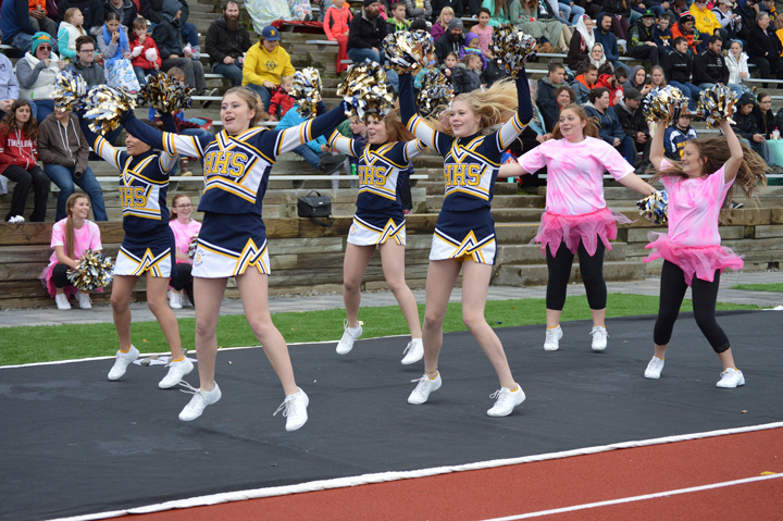 Homer High School cheerleaders pump up the crowd at Saturday’s homecoming football game against Voznesenka. The Mariners won the game 55-0.-Annie Rosenthal, Homer News