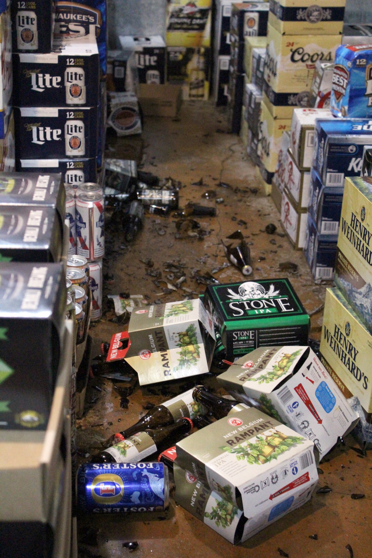 The East End Grop shop smells of alcohol, partially a result of their beer-soaked walk-in cooler. Bottles fell over, and the cases on the bottom layer of the stacks were crushed, releasing a pool of beer onto the floor.-Photo by Anna Frost, Homer News
