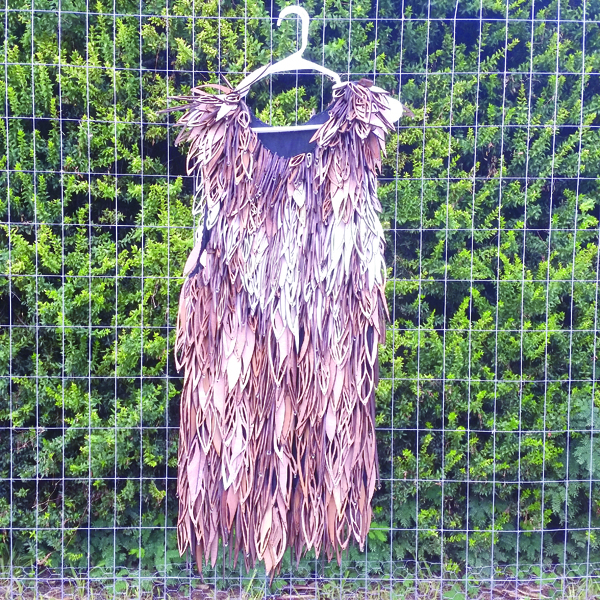 A “feather” dress made from carved wood