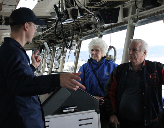 During the Veterans Day open house aboard the USCGC Hickory, Ensign David Parker describes the ship’s communication system to Amy Springer and Edward Blickhahn.-Photo by McKibben Jackinsky, Homer News