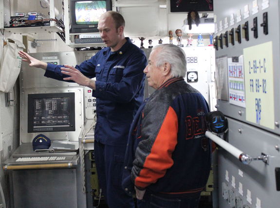 Petty Officer Will Nipp describes control systems aboard the Hickory to Edward Blickhahn during the ship’s open house.