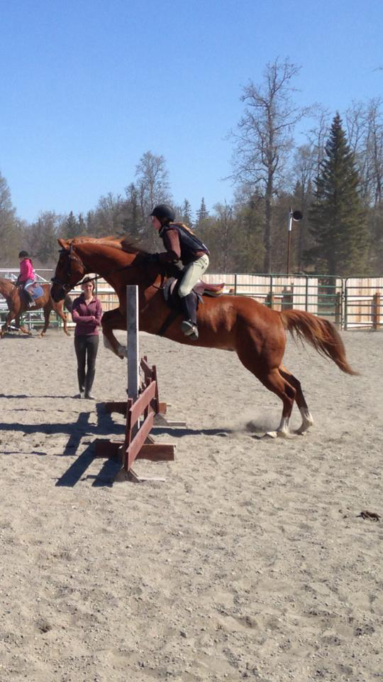 Libby Fabich and her horse practice jumping.-Photo by Jeannie Fabbich