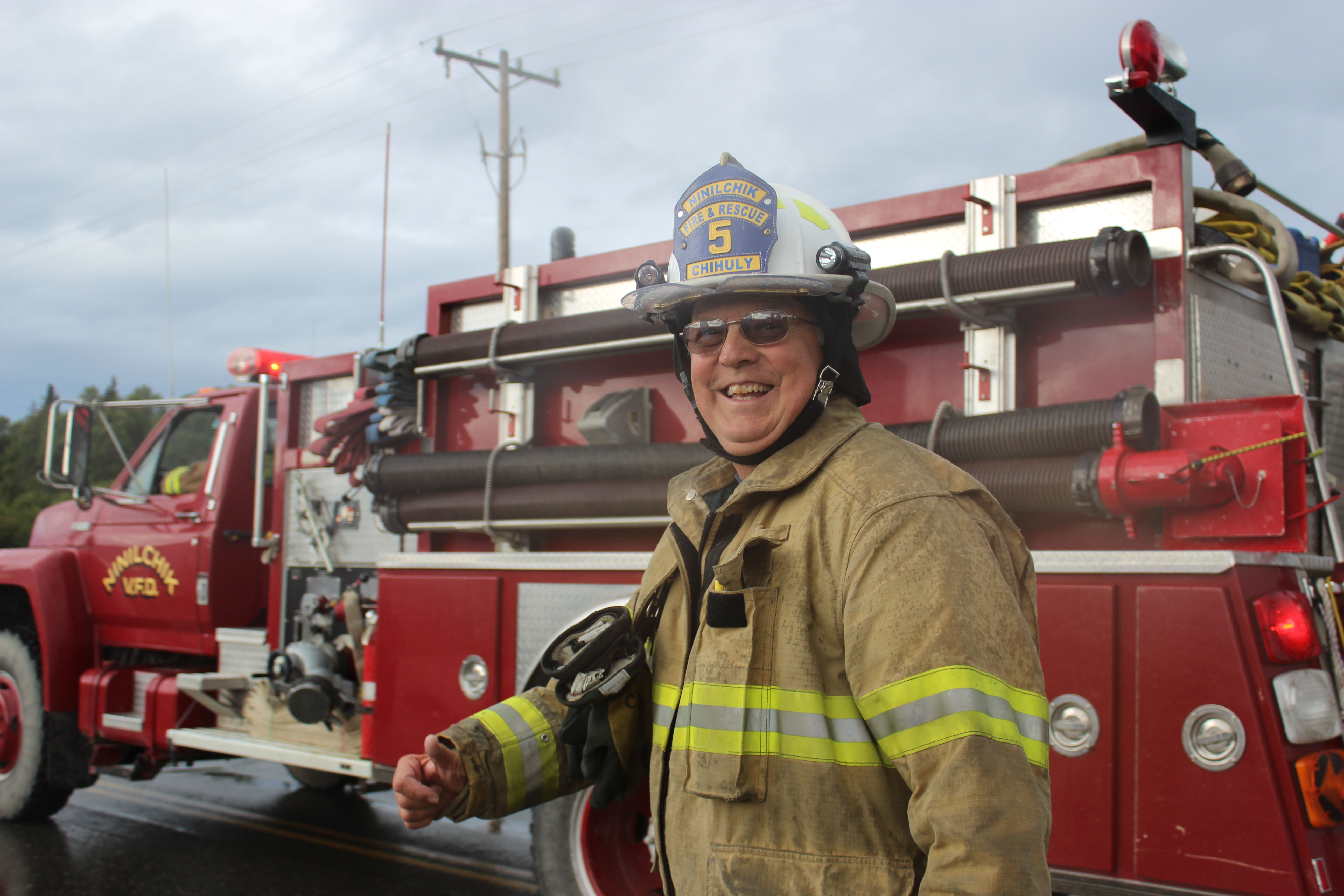 Mike Chihuly, former fire chief of Ninilchik Emergency Services, takes part in Saturday's Kenai Peninsula Fair parade in Ninilchik.-Photo by McKibben Jackinsky; Homer News