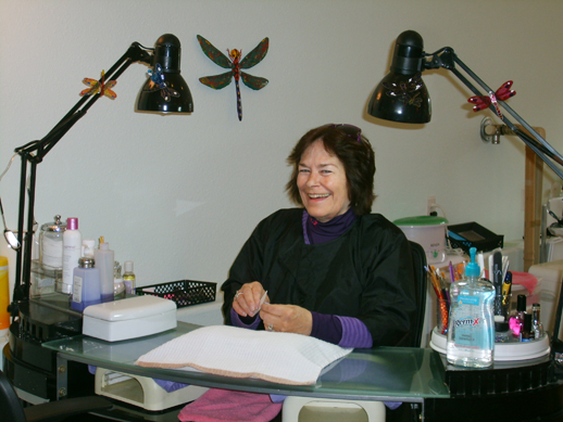 Dee Bottineau, owner of Dragonfly Nails by Dee, chats with a visitor at her salon’s new location at 1225 Lake Shore Drive.-Photo by Lori Evans, Homer News