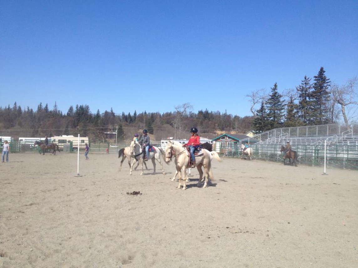 A western riding lesson gives Horse Camp participants new skills.-Photo by Jeannie Fabbich