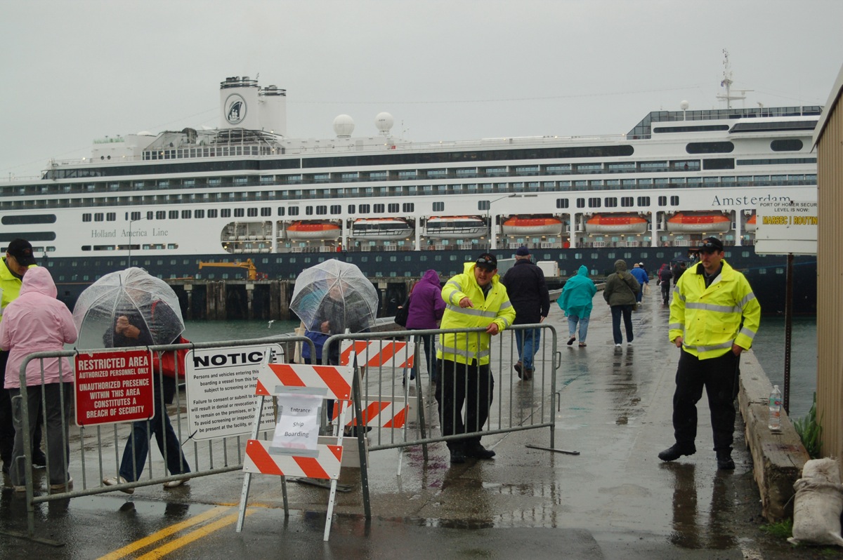 Security officers check passengers leaving and returning to the Holland America cruise ship Amsterdam at the Deep Water Dock during the summer of 2010. The Amsterdam visited Homer nine times that summer after Holland America added a leg to a 14-day cruise that also took the 1,380-passenger ship to Anchorage and Kodiak in southcentral Alaska and to Ketchikan, Skagway, Sitka, Juneau and Victoria, B.C. -Homer News file photo